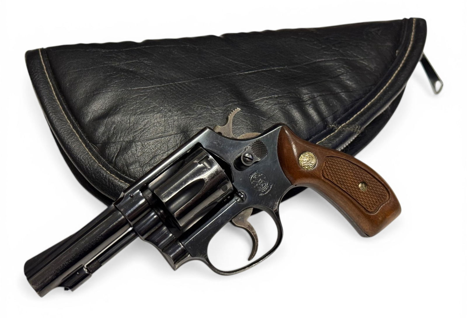 Smith & Wesson Model 30-1 .32 S&W LONG Revolver with Leather Gun Case: S#: H8791 | 3" Barrel | 6-shot SA/DA | Comes with leather gun case |||| CONDITION: Very good. Shows around 95% original blue finish with some holster wear on muzzle tip and cylinder. CCH finish on ham