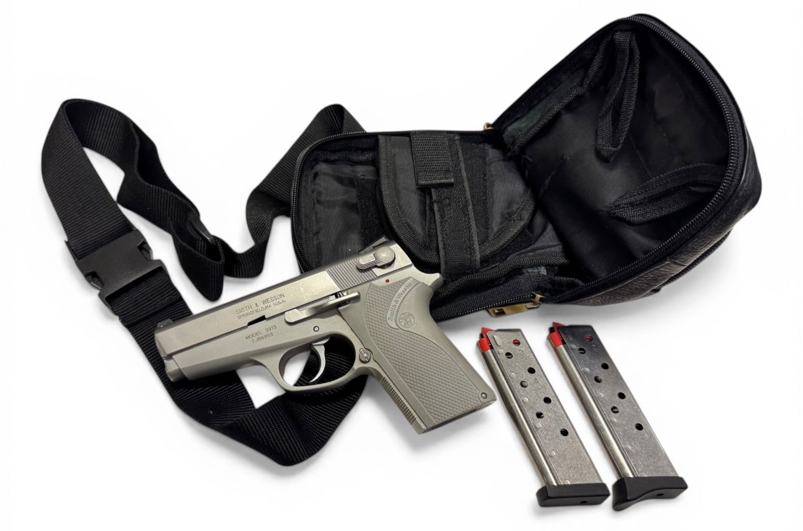 Excellent Smith & Wesson Ladysmith Model 3913 9mm Semi-Automatic Pistol: S#: TJB6953 | Comes with (2) 8rd. Magazines and a nice cross shoulder carry bag | Double Action, Aluminum alloy frame pistol |||| CONDITION: Excellent with just a few minor storage scratches that can