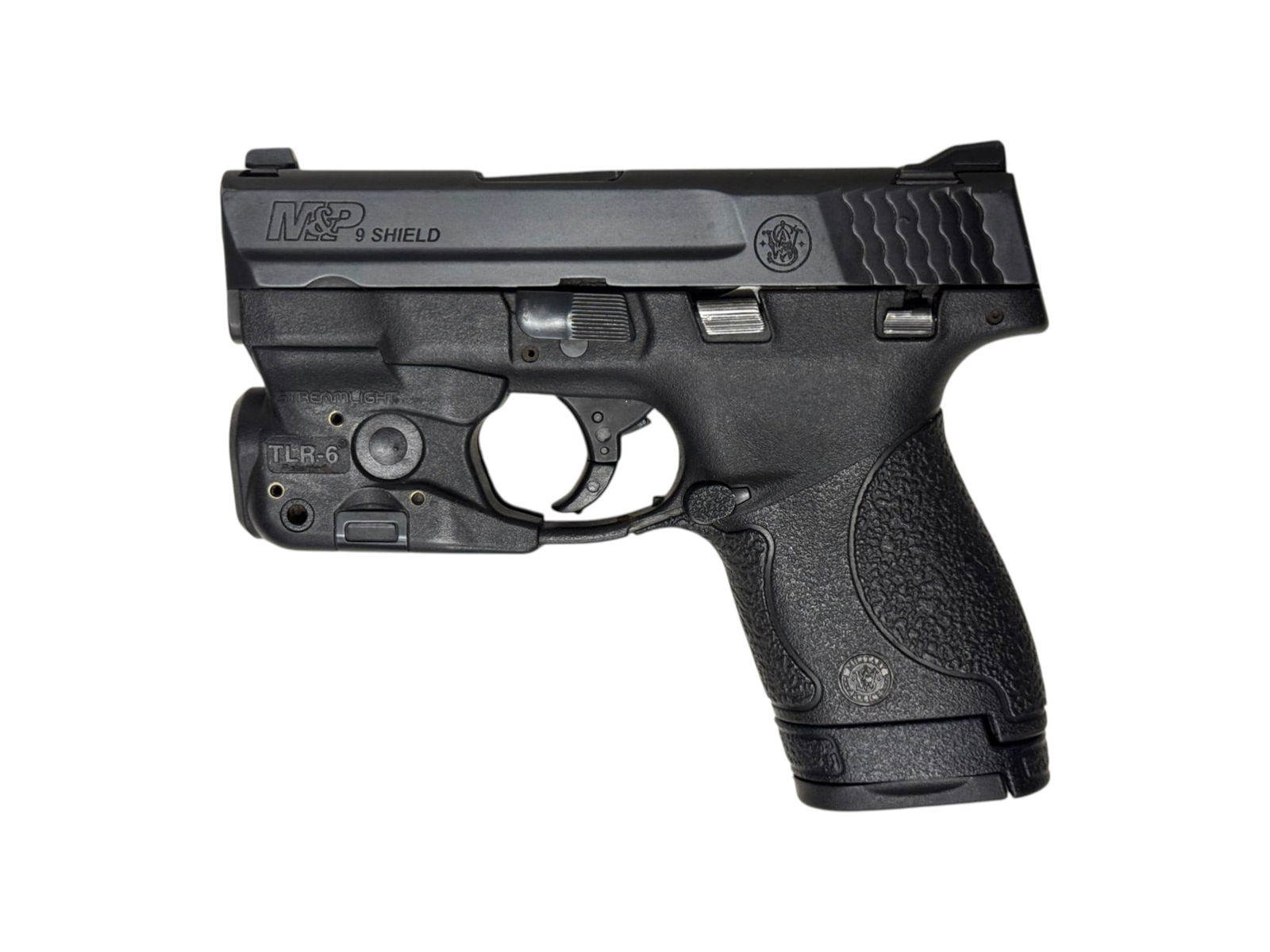 Excellent Smith & Wesson M&P 9 Shield Semi-Automatic 9mm Pistol w/ Streamlight TLR-6 Laser: S#: JHT5052 | Comes with (1) 7rd. .40 S&W marked magazine (still works with 9mm) |||| CONDITION: Excellent, shows some minor use/storage wear. Mechanically functions. Bore is excellent.