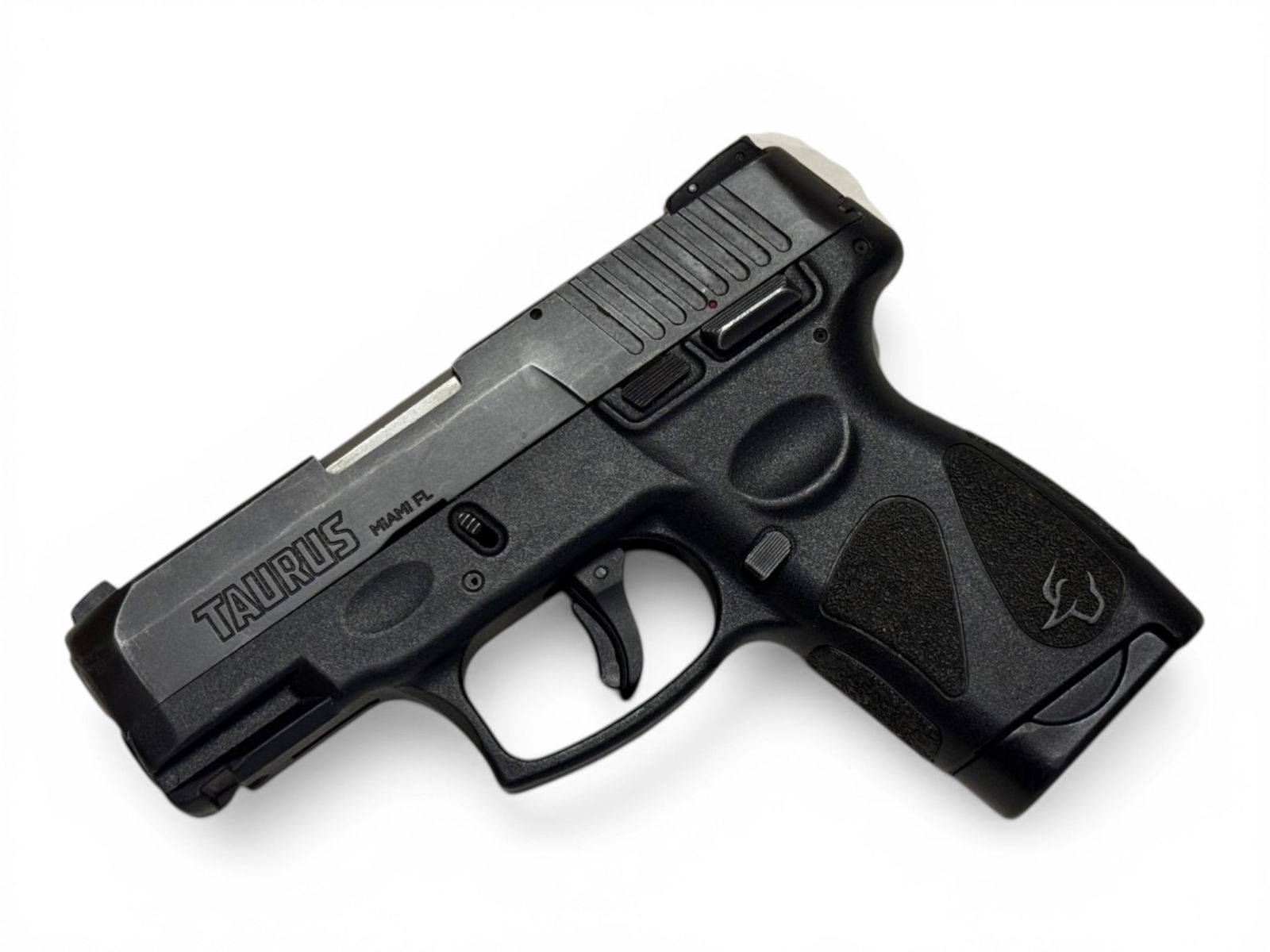 Taurus G2s Semi-Automatic 9mm Pistol in Box: S#: TLT67262 | Comes in factory taurus box with non-matching label, and (1) 7rd. Magazine |||| CONDITION: Good. 98% original finish showing holster wear on front and sides of gun. Mechanically