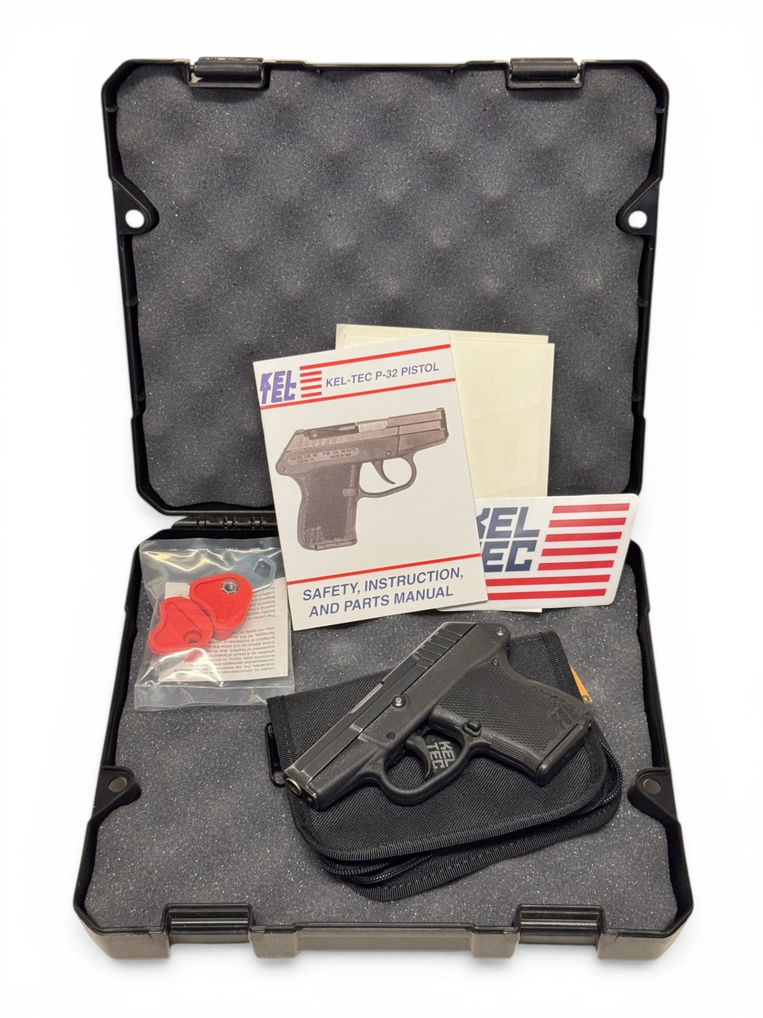 Kel-Tec P-32 Semi-Automatic .32 AUTO Pocket Pistol in Case: S#: D2X58 | Comes in a factory Kel-Tec hard case with non-matching label, and has a soft pouch and manual. Comes with (1) 6rd. Magazine |||| CONDITION: Good. 90% original finish with wear and signs of