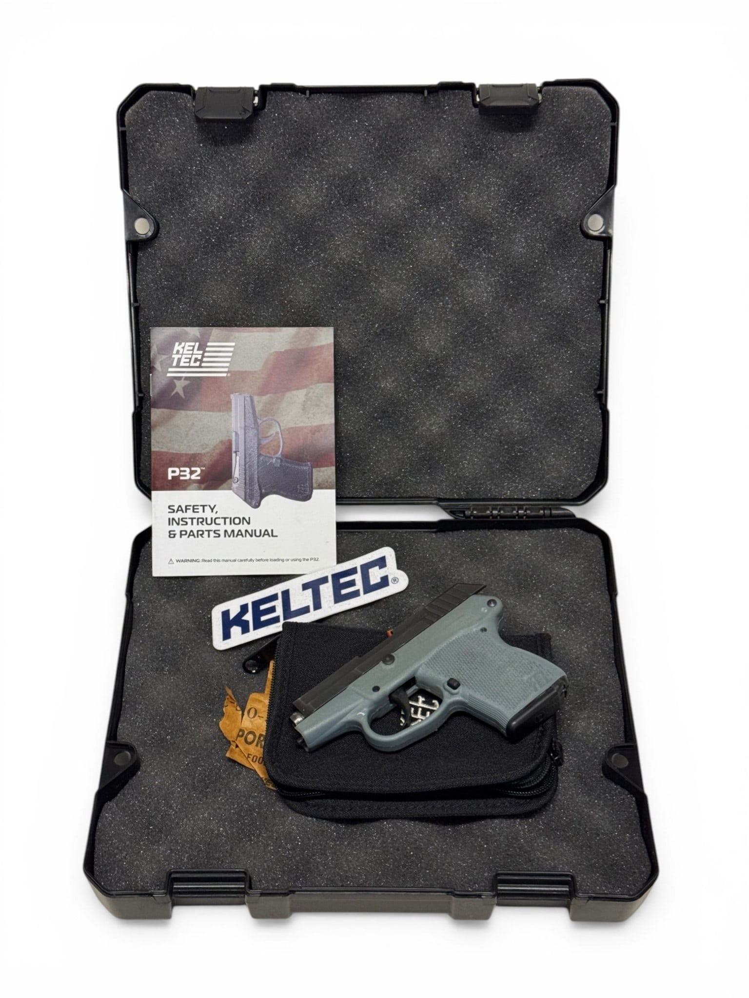 Excellent Kel-Tec P-32 Semi-Automatic .32 AUTO Pistol in Case: S#: D7K95 | Comes in factory Kel-Tec hard case with matching label, manual, sticker, soft case and (1) 6rd. Magazine |||| CONDITION: Excellent. Shows a few minor storage marks and signs of light use.