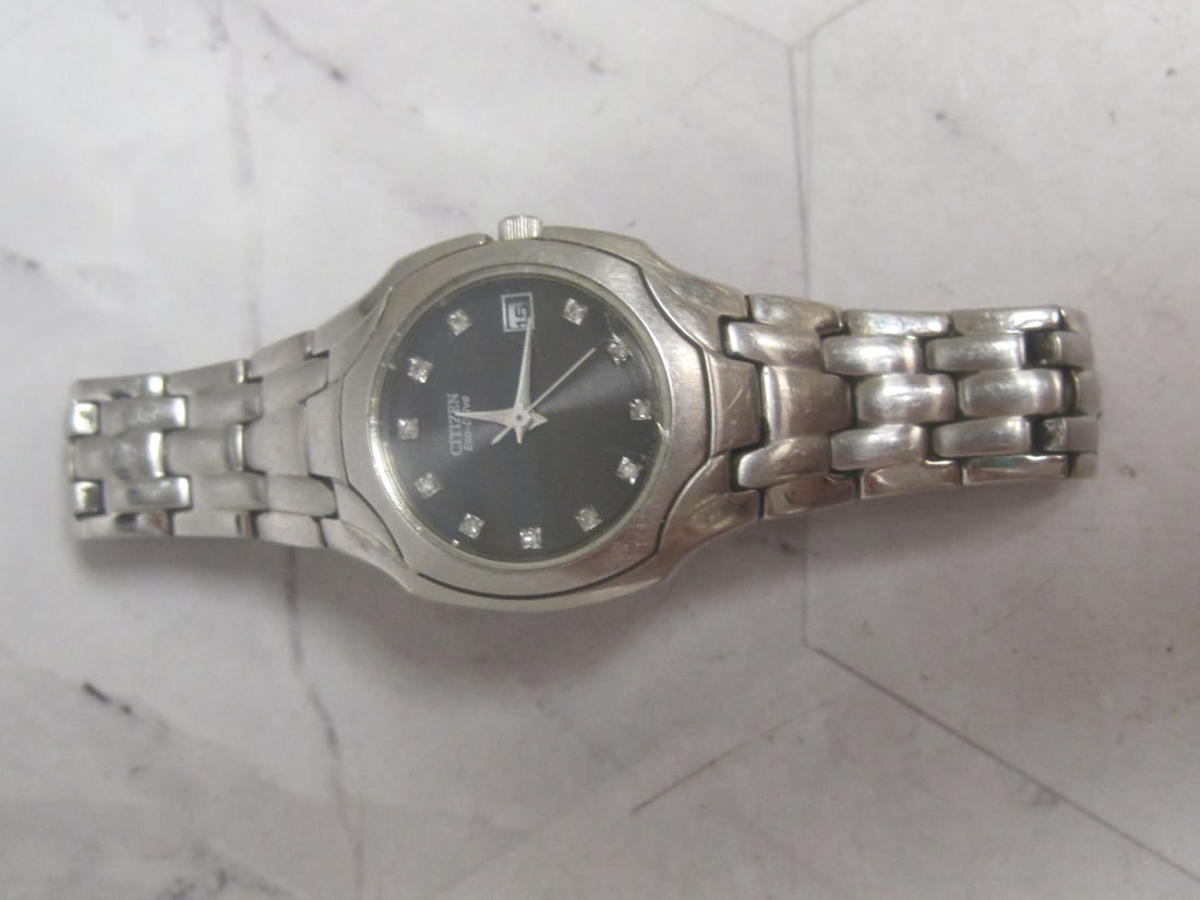 Ladies Citizens Eco Drive Watch with Diamond Hour Markers: Running, crack & scratches on crystal 