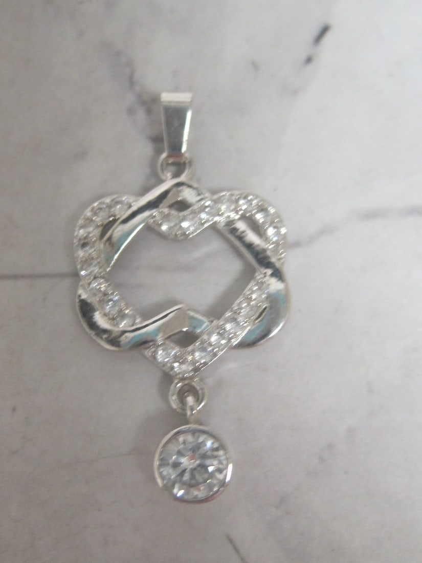 Sterling Silver CZ Heart Pendant: Weighs 2.1 grams 