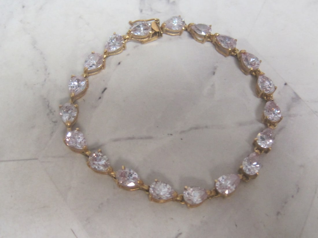 7" 10k Gold Bracelet with Lavender Stones: Weighs 12.5 grams 