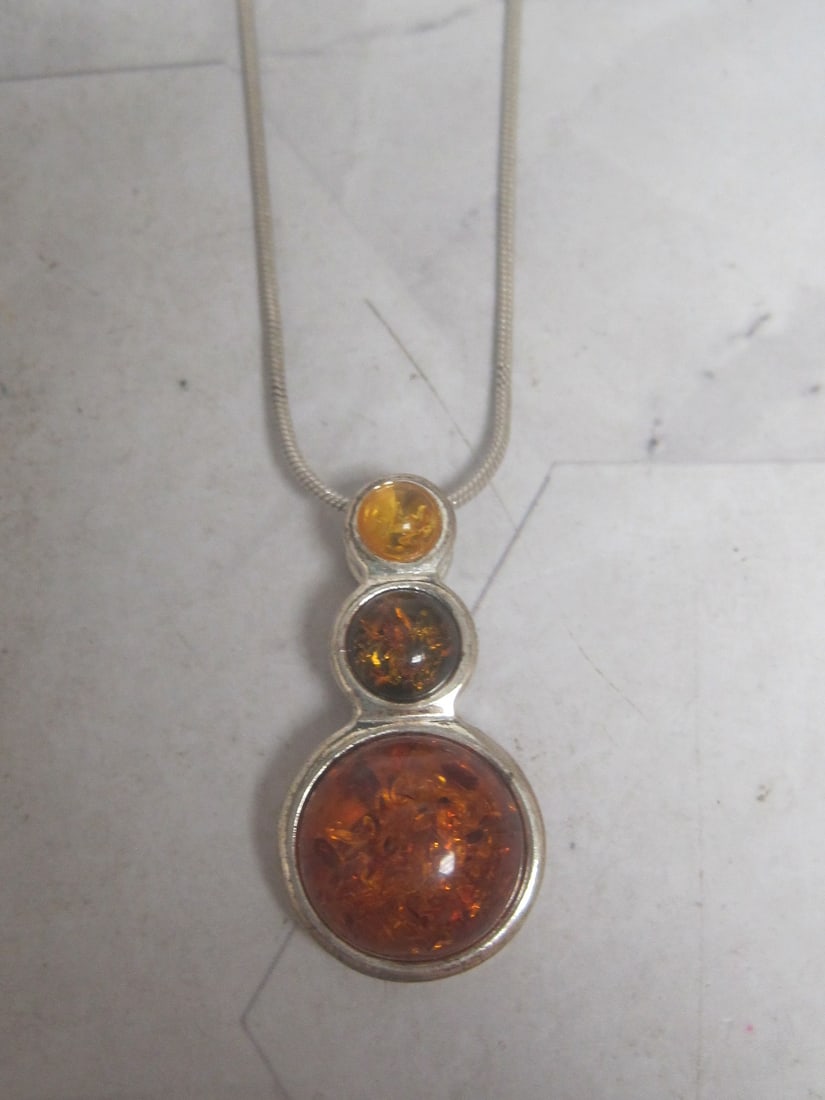 Sterling Silver Amber Pendant on 18" Sterling Silver Chain: Weighs 9.5 grams 