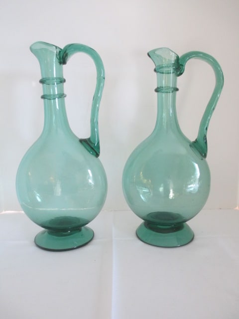 Two Hand Blown Green Art Glass Ewer Pitchers: 14 1/4"h, one has crack at applied handle 
