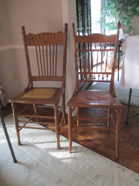 Two Antique Victorian Spindle Back Kitchen Chairs: Caned seat 16"w(seat needs repair, seat has been repaired with metal plates, two legs have cracks), Nail head leather seat 16 1/2"w(seat has burlap strap support, seat corner support missing screw), S