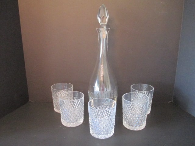Engraved Decanter and Five Diamond Point High Ball Glasses: Decanter 15 1/4"h-stopper has flea bites and engraved "Jennings", (5)3 1/2" glasses 