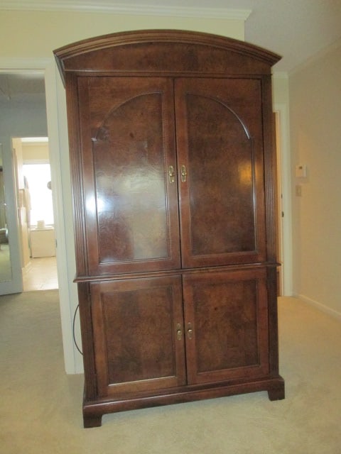 Hekman Mahogany and Burlwood Media Cabinet: One(1) Piece Unit, upper section has pocketing doors, raised shelf and power strip, lower section has hinge back doors and fixed shelf, back panel has factory holes for cables, 44" x 22 3/4" x 78 1/2"