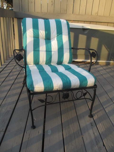 Black Wrought Iron Arm Chair: 29"w, includes green/white stripe canvas removable cushion, few paint flakes, Local Pickup Only 