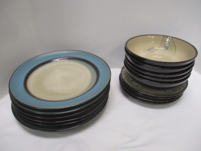 15 Pieces of Pier 1 Imports "Teal Reactive" Stoneware Dinnerware: (6)11"dia plates, (5)7 3/4"dia bowls, (4)8 1/4"dia plates, utensil marks 