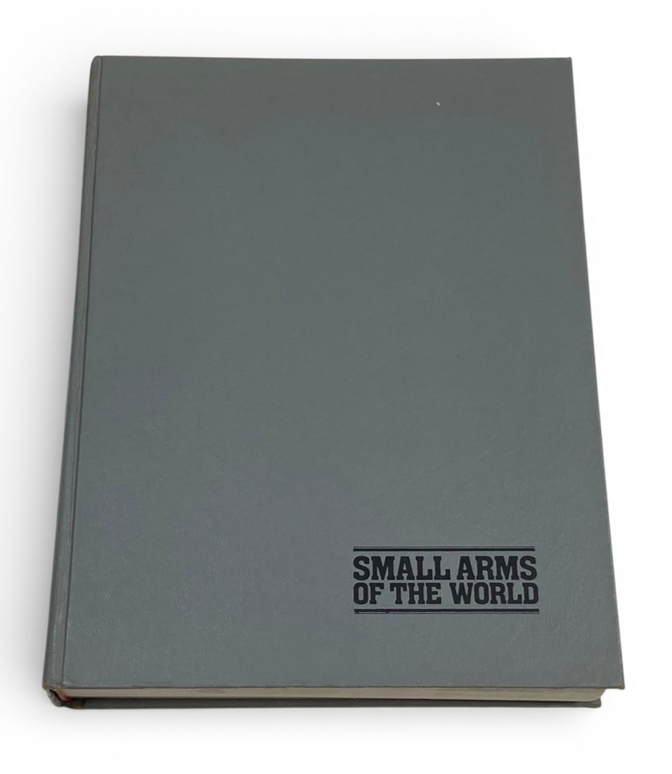 Small Arms of the World by Edward Clinton Ezell: Good and Solid condition. Some evidence of water contact on some pages. See photos. 