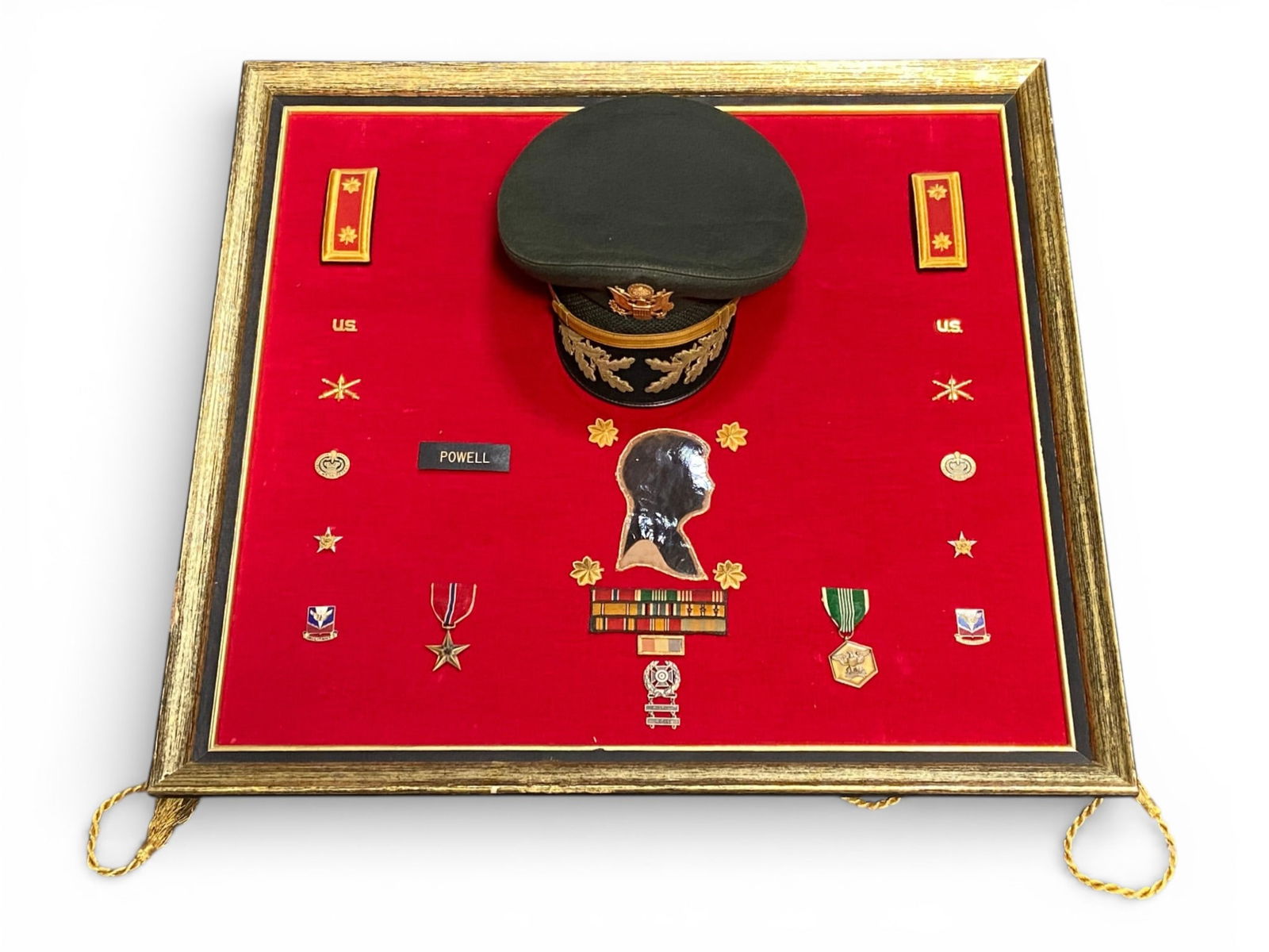 Grouping to a LT COL John D Powell Jr: Comes with 1960s Officer Hat, LT COL Shoulder Rank Tabs, US Pins, Name Plate, Bronze Star Named, Army Commendation Medal Named, Award Rack, POW MIA Badge, And Rank Insgnias. |Frame Is 27"x29"