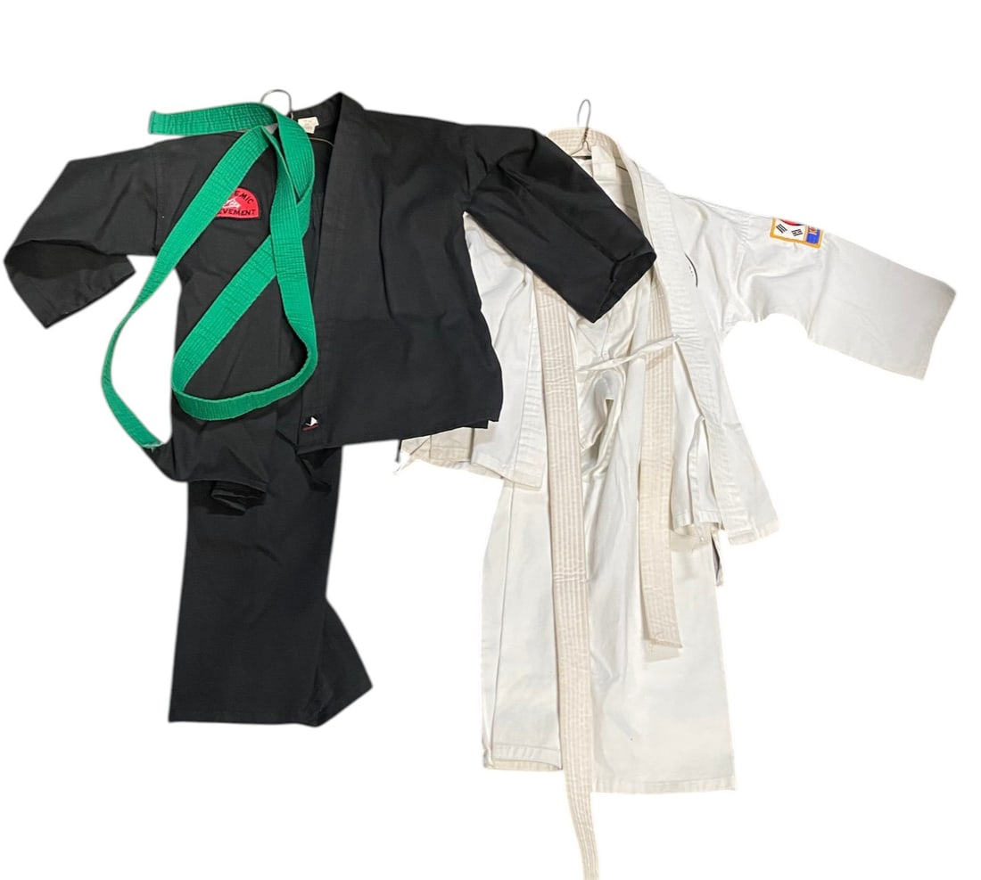 (2) Taekwondo GI's with Green Belt and White Belt and Patches: (1) Black GI has Academic Achievement Patch and is Size 0. (1) White GI has a Chung Taekwondo Patch with Tiger and Korean Patch. Size 0, and has fading on the back. See Photos 