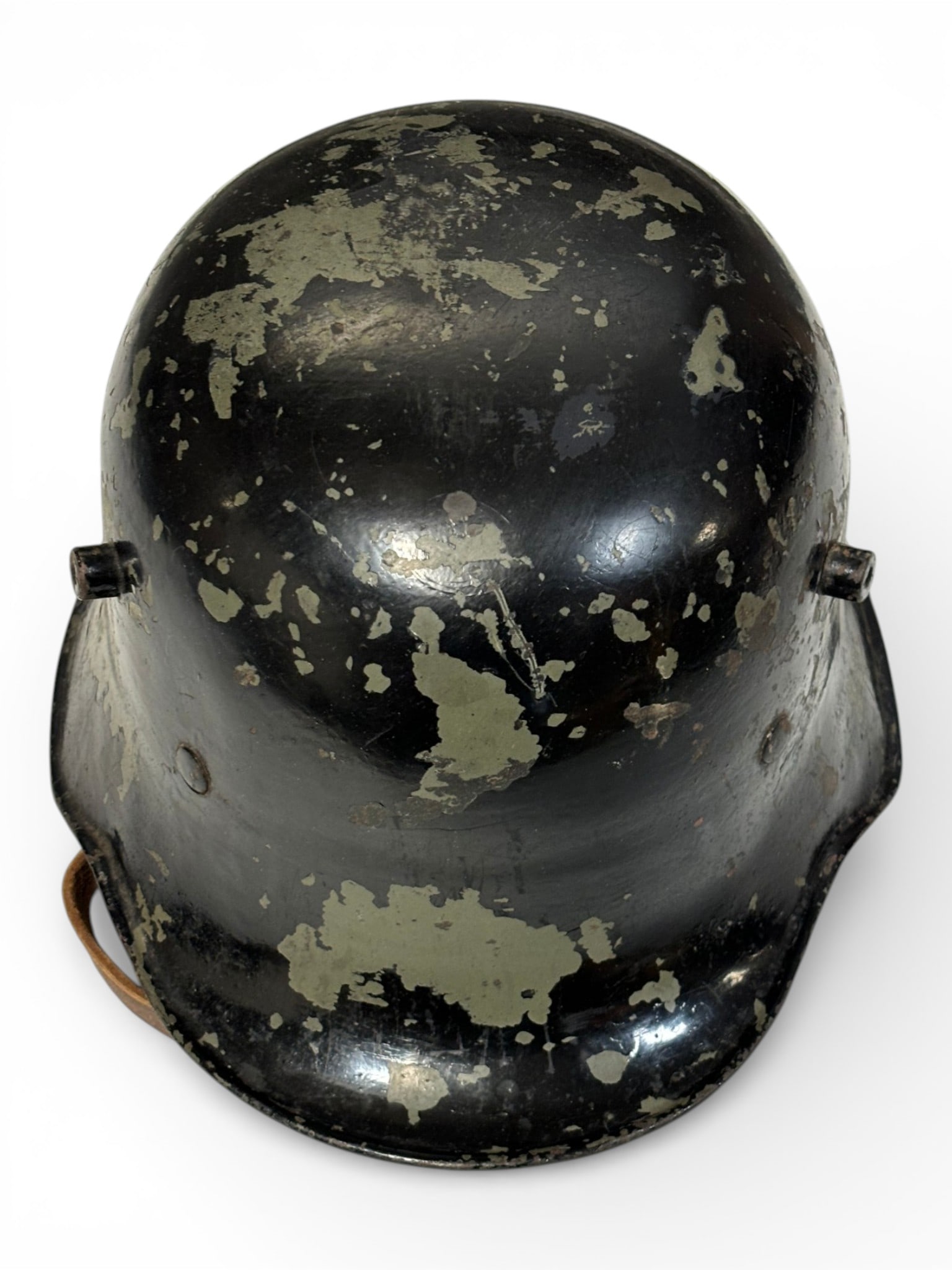 WWI Stahelm M16 Helmet with Liner and Chinstrap: Helmet has been painted black. No visible markings but overall looks good with wear to the finish. 