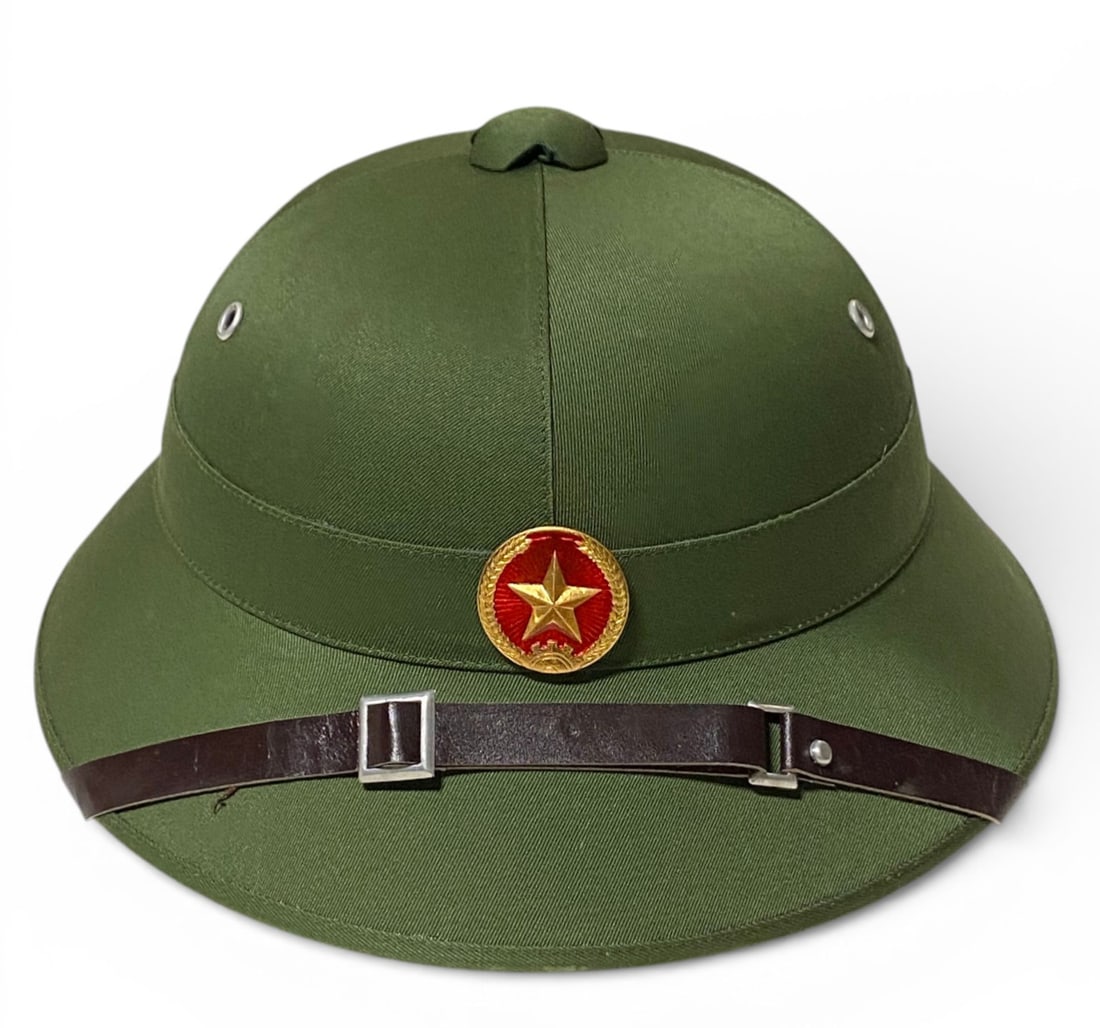 North Vietnamese NVA M-26D Pith Helmet with Liner and Chinstrap: Seems to be in excellent condition, with decal still present. 