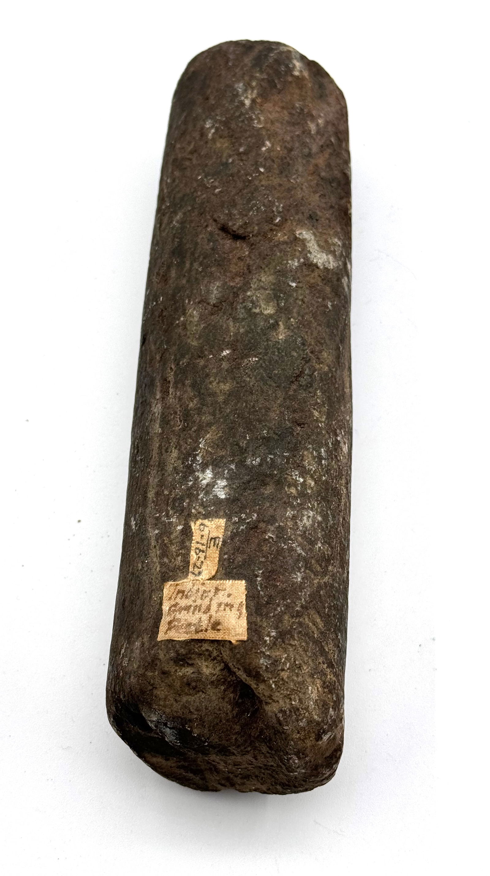 Large 7.5" Native American Grinding Pestle Stone: See photos.This Native American Pestle or Hammer stone is more in the rough than the previous lot and is rigid with little polish and also shows use and wear. Measures approximately 7.5"