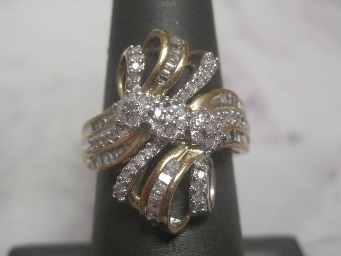 10k Gold Diamond Ring: Weighs 5.1 grams, Size 7 1/4, Loaded with baguette & round cut diamonds 
