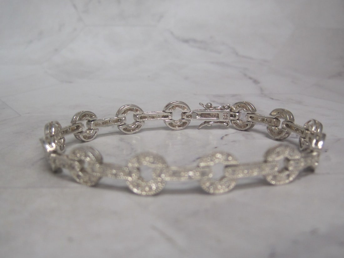 7 3/4" Sterling Silver CZ Bracelet: Weighs 15 grams, Circle & bar design 