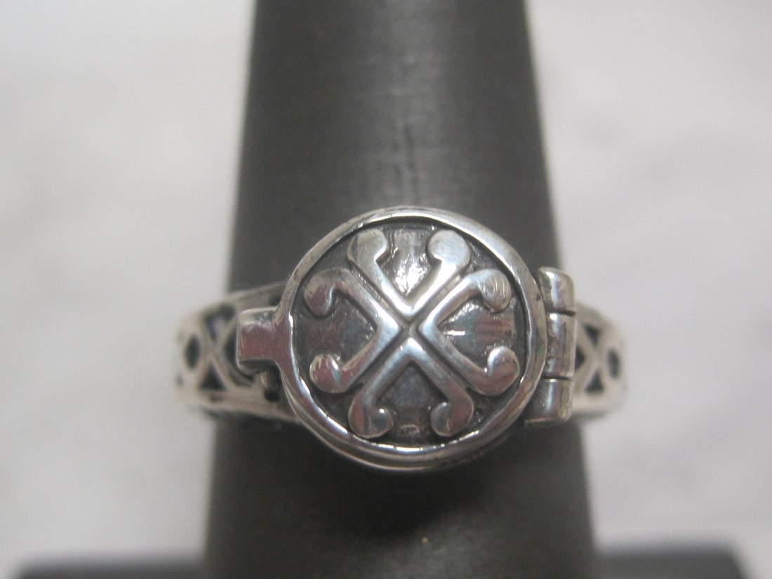 Sterling Silver Poison Ring: Weighs 5.5 grams, Size 8, Hinged top, fancy openwork