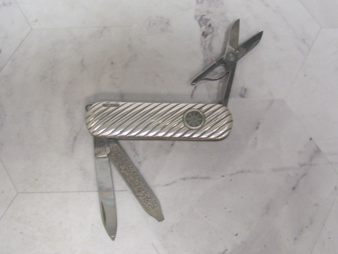 Sterling Silver Pocketwatch with Scissors, Nail File, & Blade: Ribbed swirl, with pendant loop 