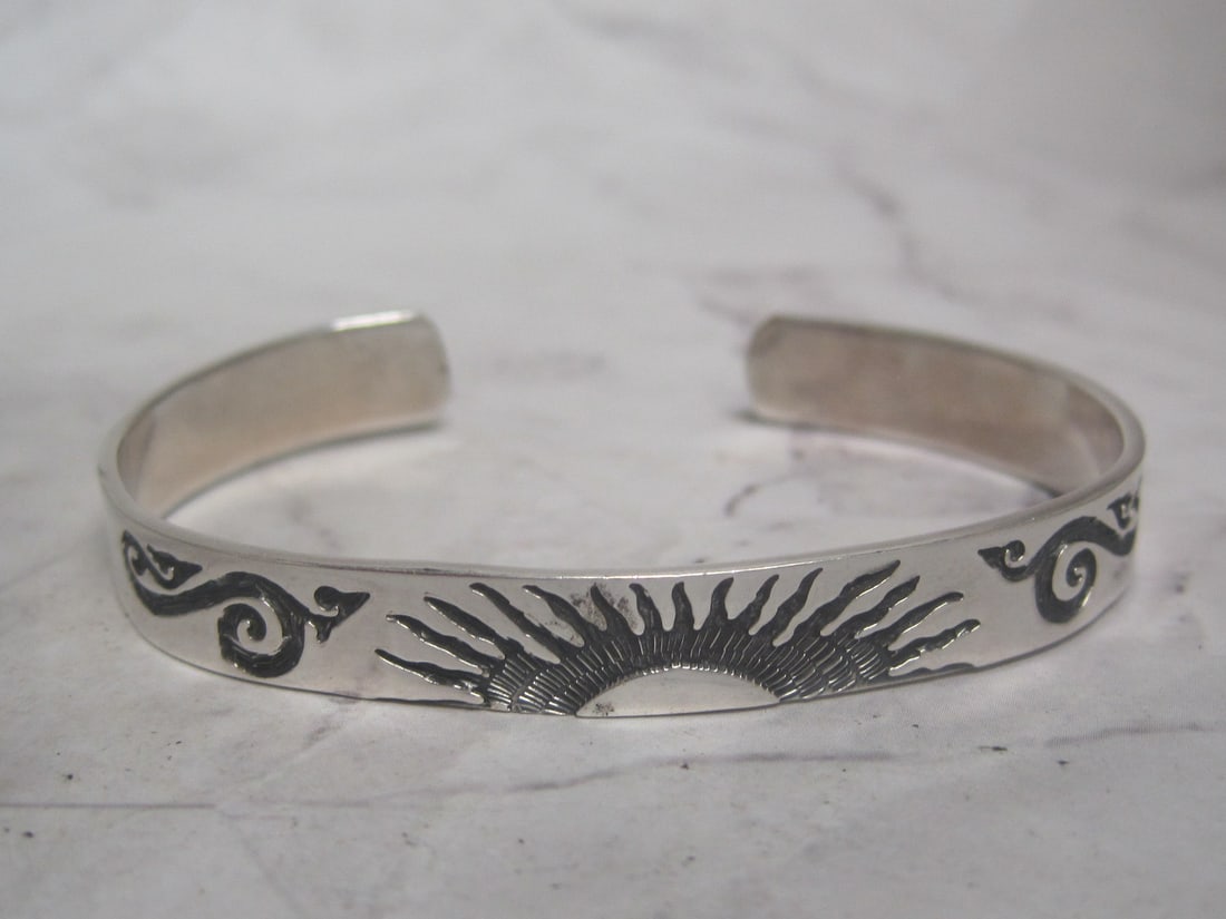 Sterling Silver Southwest Style Bracelet: Weighs 19 grams, adjustable cuff, Sunburst & other dÃ©cor 
