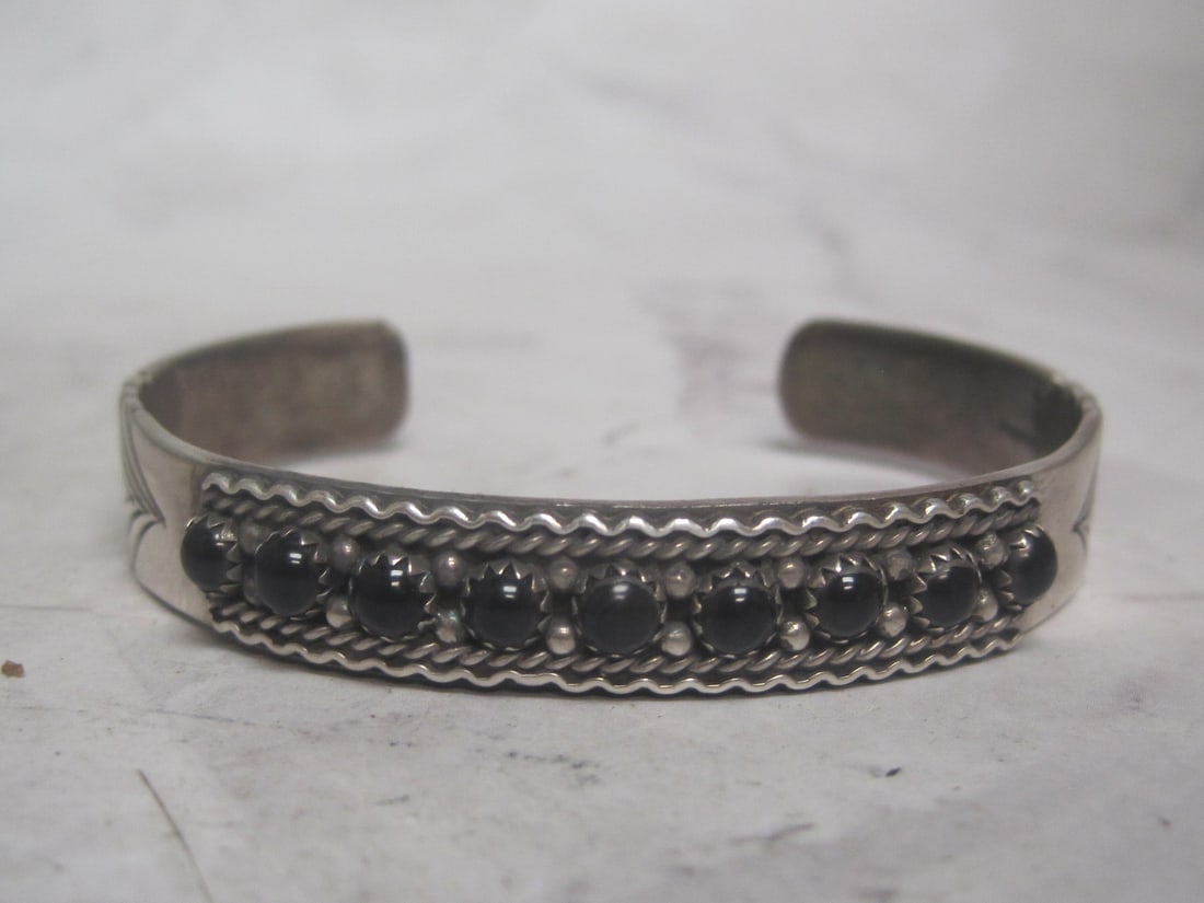 Sterling Silver & Black Onyx Navajo Bracelet: Weighs 23 grams, Cuff style, 9 black cabochons, signed 