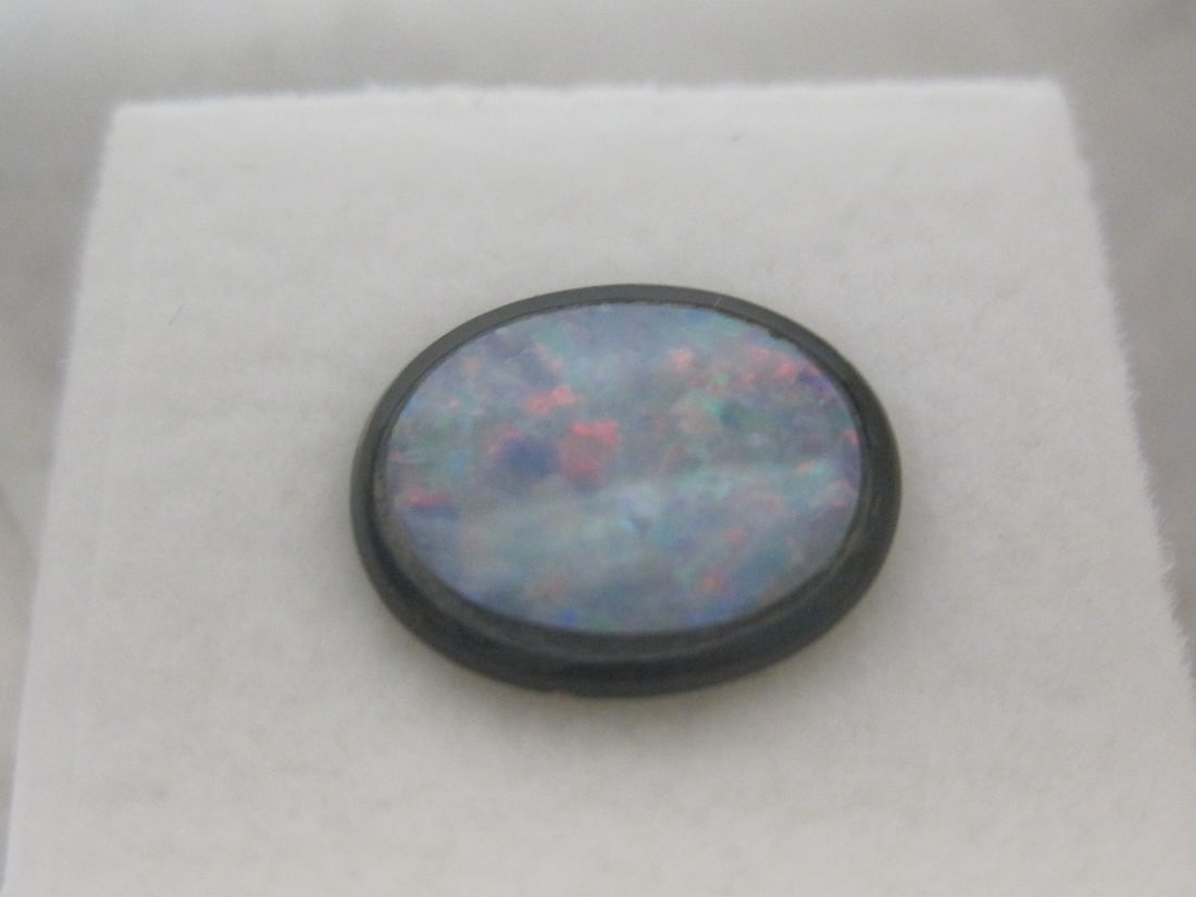 Black Opal Doublet: Fiery gem on black background, oval, 12x10mm, 2 carats total 