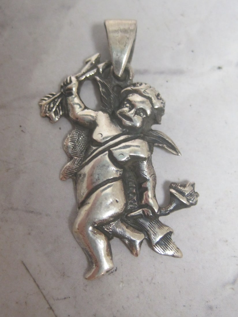 Sterling Silver Cherub Pendant: Weighs 5.1 grams 