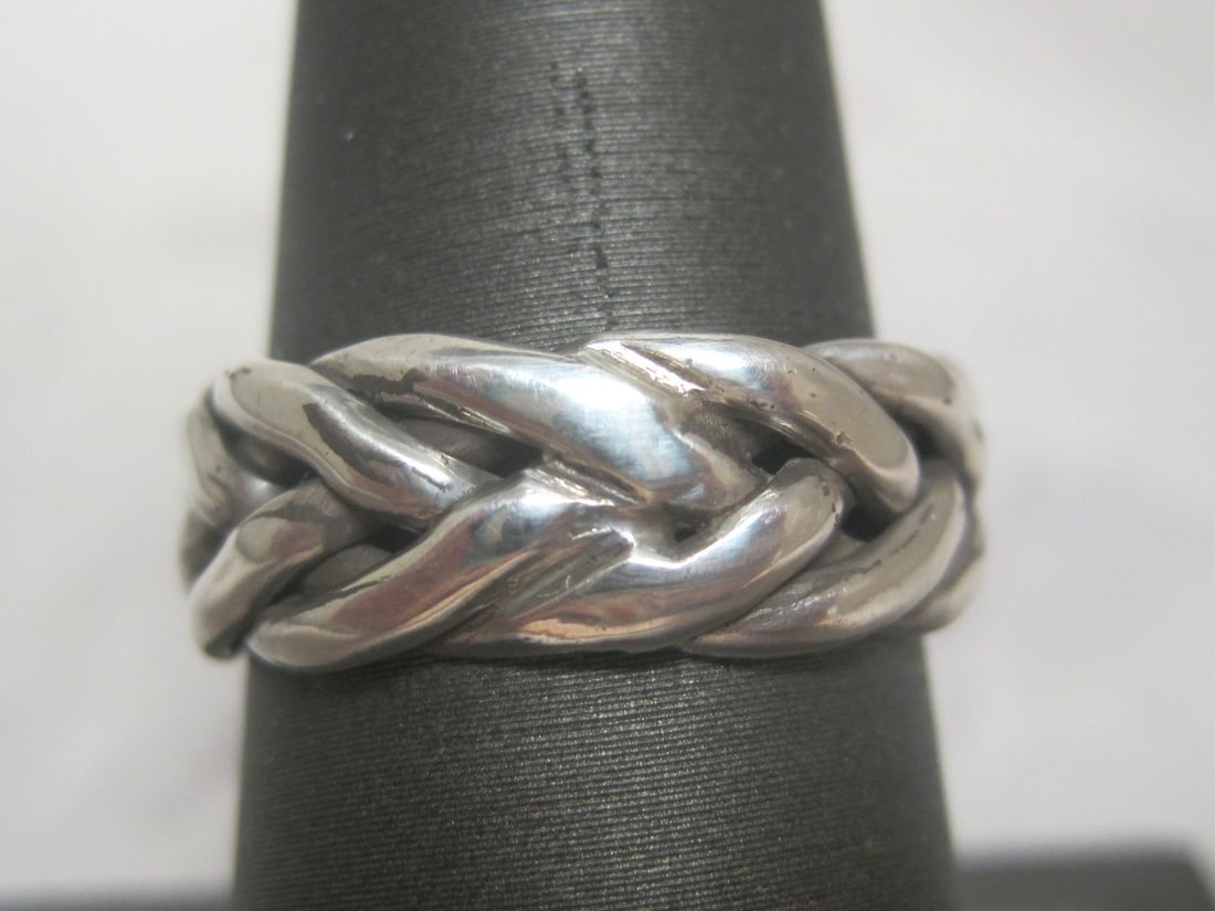 Sterling Silver Band: Weighs 5.4 grams, Size 8, Braided design 