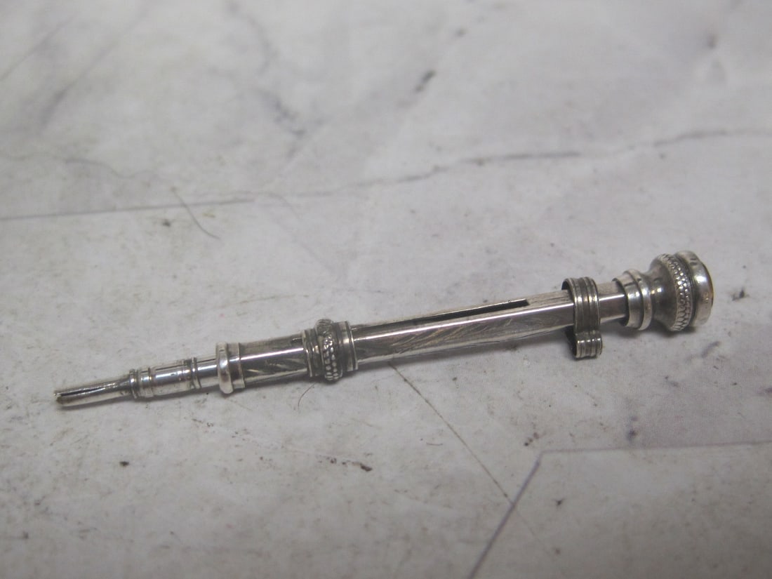 Victorian Miniature Sterling Silver Mechanical Pencil: English hallmarks, with loop to wear on chatelaine or chain, 1 1/2" closed, 2" open 