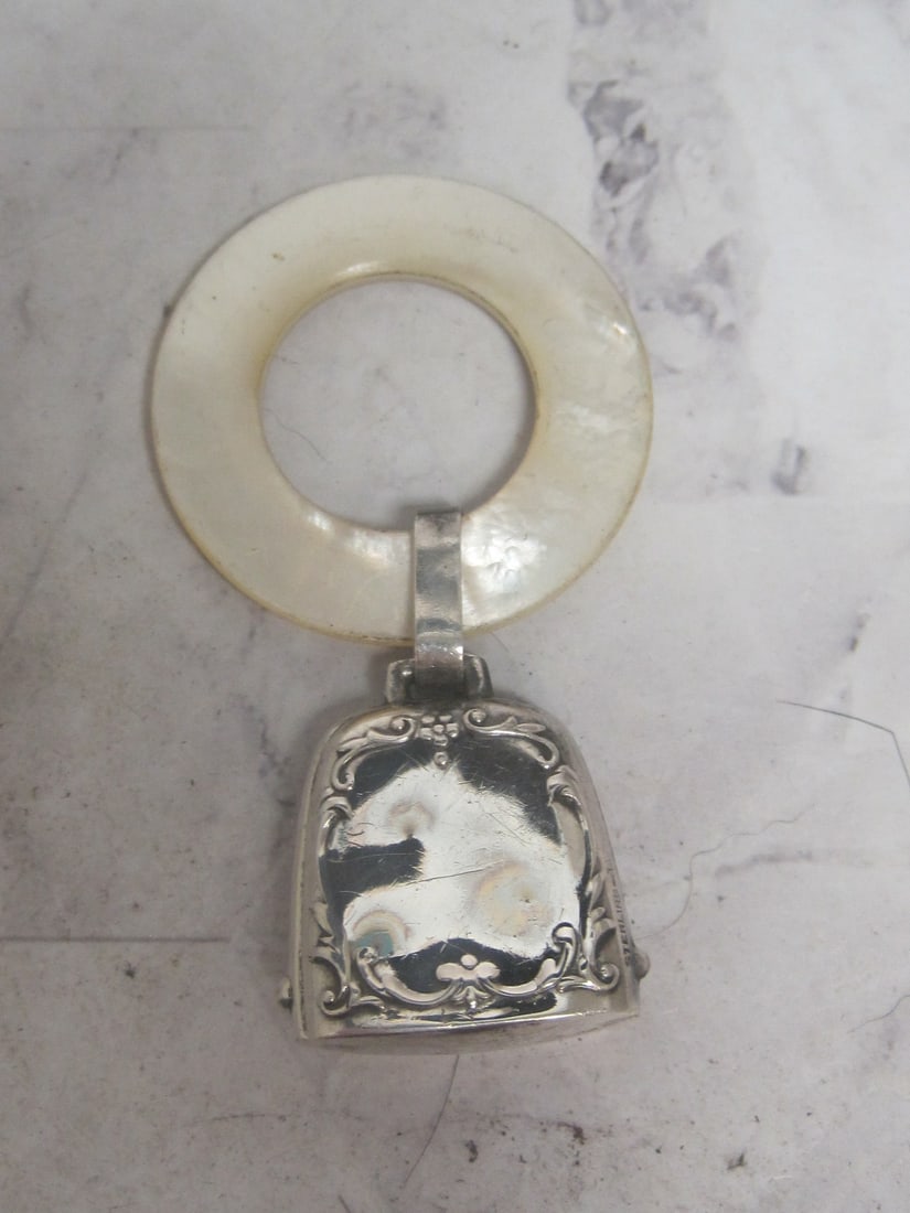 Antique Sterling Silver Baby Rattle with Mother of Pearl Teething Ring: Bell in rattle, overall 2 3/4" long