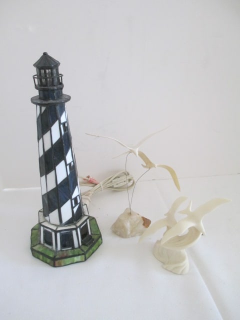 Stained Glass Style Lighthouse Night Light and Two Seagull Sculptures: Light works-12"h, Gulls in flight with quartz base 7 3/4"h(few small nicks on wings), Sculpted resin gulls 4 3/4"h