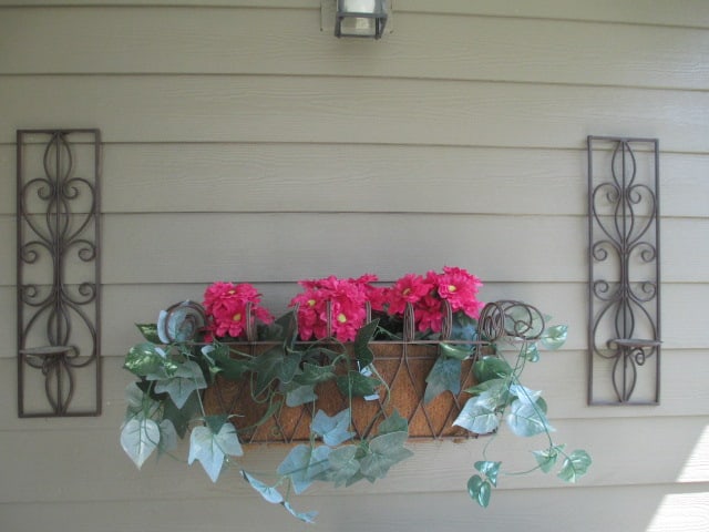 Pair of Bronze Finish Metal Pillar Candle Scones and Wire Wall Mount Planter Box: Scones 6 3/4" x 24", Planter box 30" x 9" x 11", planter box has coconut fiber lining and artificial greenery, Local Pickup Only 