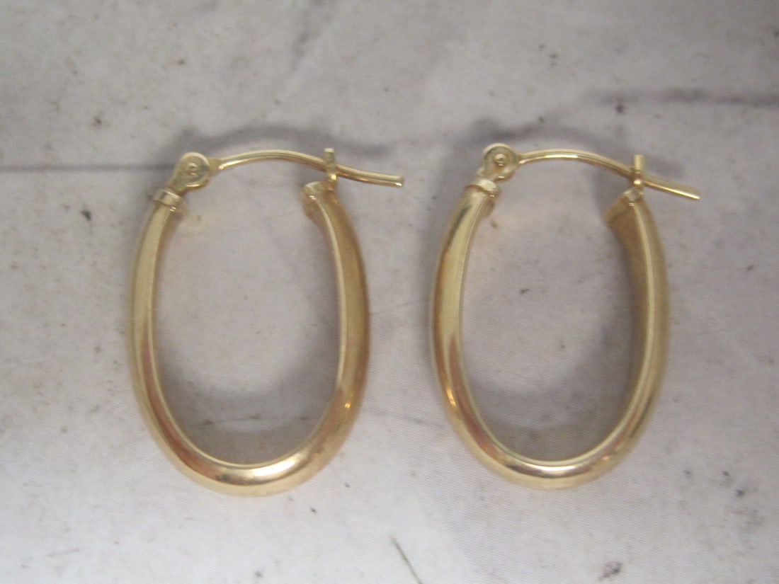 14k Oval Hoop Earrings: Weighs 1 gram 