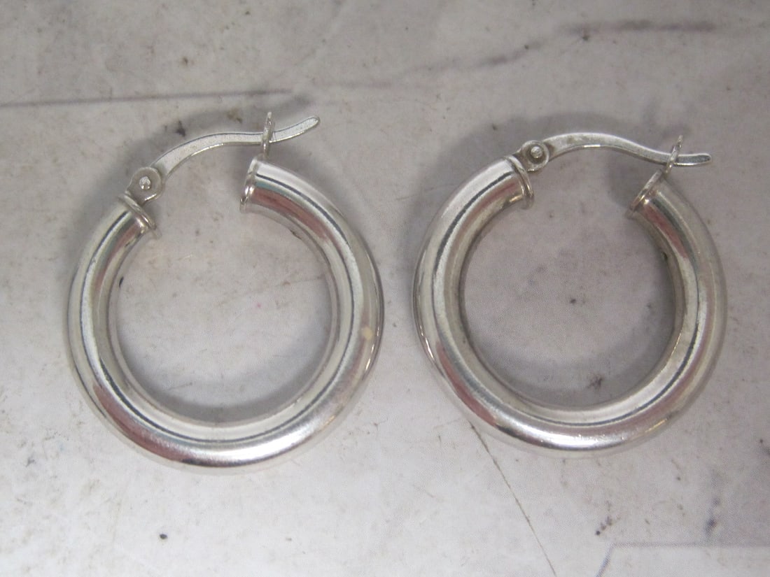 Sterling Silver Hoop Earrings: Weighs 3.8 grams 
