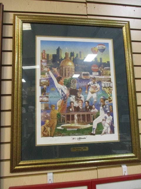 1996 Framed and Matted Limited Edition "It's Atlanta" Pencil Signed Paul Miller Print: Signed and numbered 54/100 in lower left corner, has brass plaque with title and limited edition number, 28" x 31 1/2", print has been autographed in blue marker by US Olympian Mary Lou Retton and