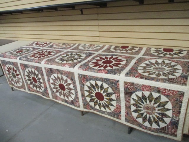 Circa 1840 Boiled Chintz "Sunburst" Hand Stitched Coverlet: approx. 100" x 100", has hand written card attached that reads " Boiled Chintz 'Sunburst' pieced by Susan Ann(Valentine)Lane about 1840", some age stains and discoloration, see all pictures and