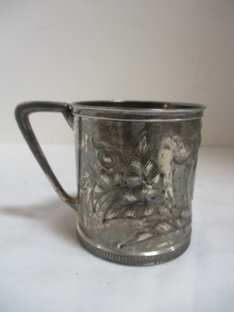 Antique Victorian English Sterling Toddler Cup: 2 3/4"h, 2.97 troy ounces, scrolling leaf design in relied, engraved name, has walking lion, anchor and G hallmark on bottom