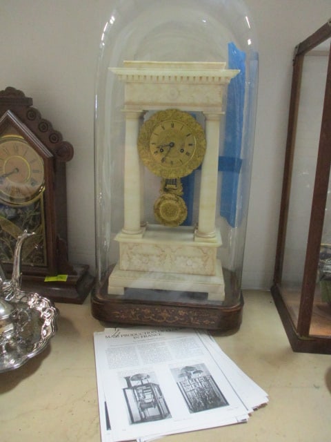 Antique French Marble Visible Escapement and Pendulum Morbier Clock in Cloche Dome: Cloche has inlaid mahogany base with large rectangular dome top cover(cracked on rounded corner has been glued and we put blue tape on for moving purposes), per clock repairman information included; C