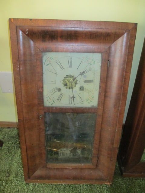 Antique Owen & Clark Ogee Mahogany "Time Is Money Clocks" Weight Driven Mantle/Wall Clock: 15 1/4" x 4" x 26", has pendulum and key. Does Not have weights, has a reverse painted panel that is loose in case. Clock needs TLC, Local Pickup Only 
