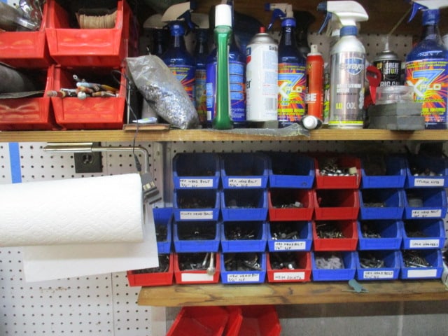 Wall Lot of Meat Grinder, Singer Sewing Machine, Fasteners, Bins, Solvents Cleaners Wax - 9