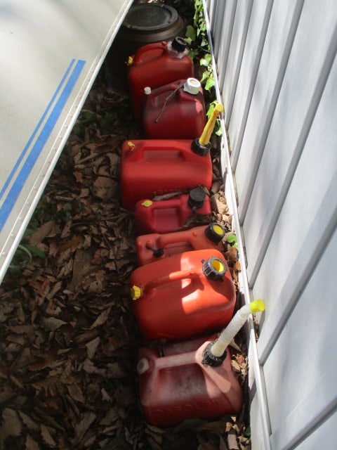 Lot of 7 Gas Cans: . 