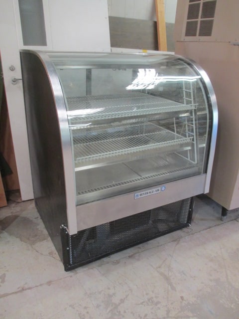 Beverage-Air Corp. Illuminated Glass Front Bakery Case: Model CDR3/1-B-20, 37 1/2" x 34 1/2" x 46", powers on, compressor comes on and cools but does not get cooler than 40-see picture of temperature log, each shelf has a fluorescent light, see pictures