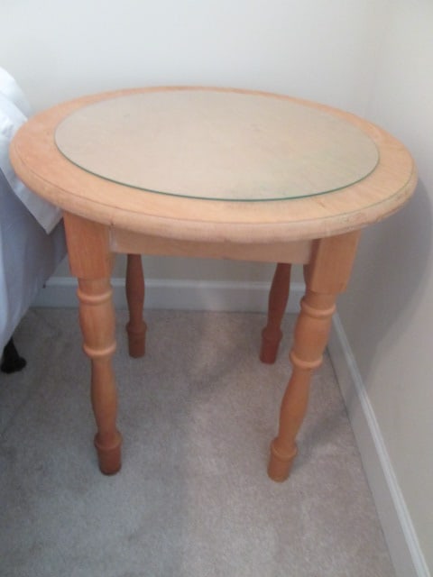 Maple Turned Leg Round Side Table: 24 1/4"dia x 25 1/2"h, includes glass top protector, appears to be unfinished-was being used as cover-up table, top has some stains, Local Pickup Only
