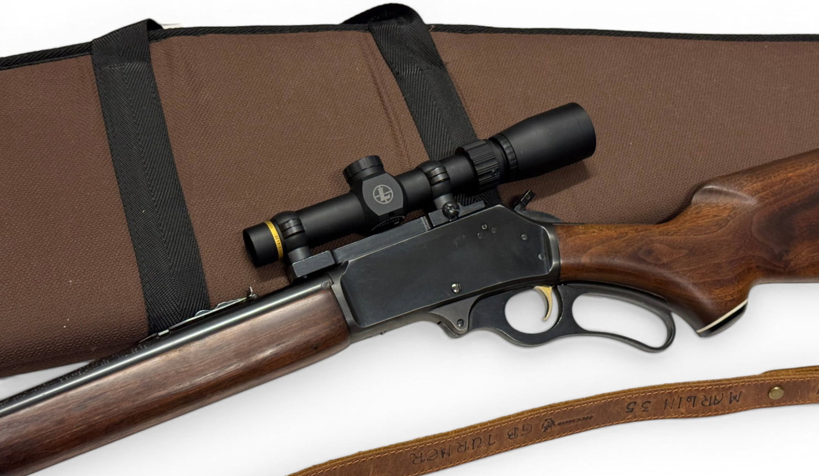Excellent 1971 Marlin Model 336 .35 REM. Lever Action Rifle w/ Leupold Scope, Sling and Soft Case: S#: 71200778 | 20" Micro-Grooved "JM Stamped" Barrel | Comes with JM hammer extension, leather sling, Leupold VX-Freedom 1.5-4x20 scope | Beautiful Gold trigger and Jeweled bolt |||| CONDITION: