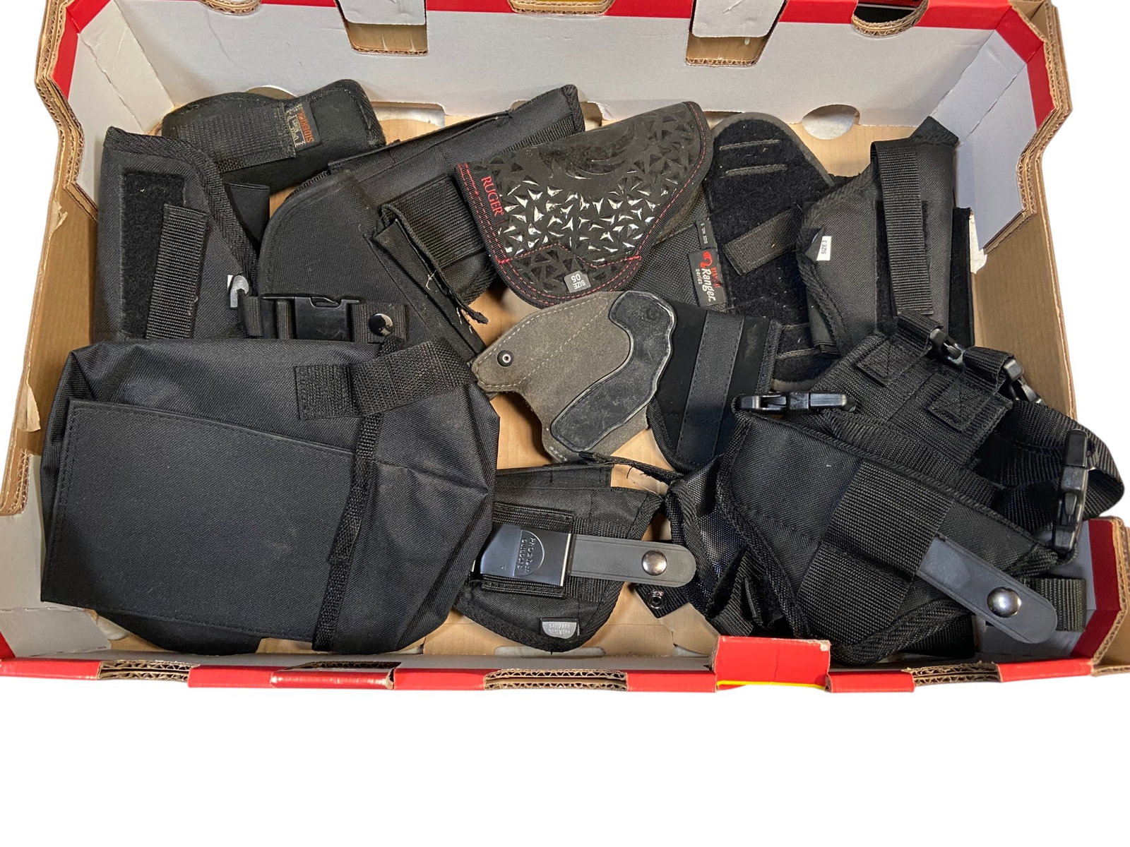 Large Lot of (11) Nylon Pistol Holsters: See photos for what’s all here. Includes Ruger, Bianchi, Pro Tech, Uncle Mike’s and more
