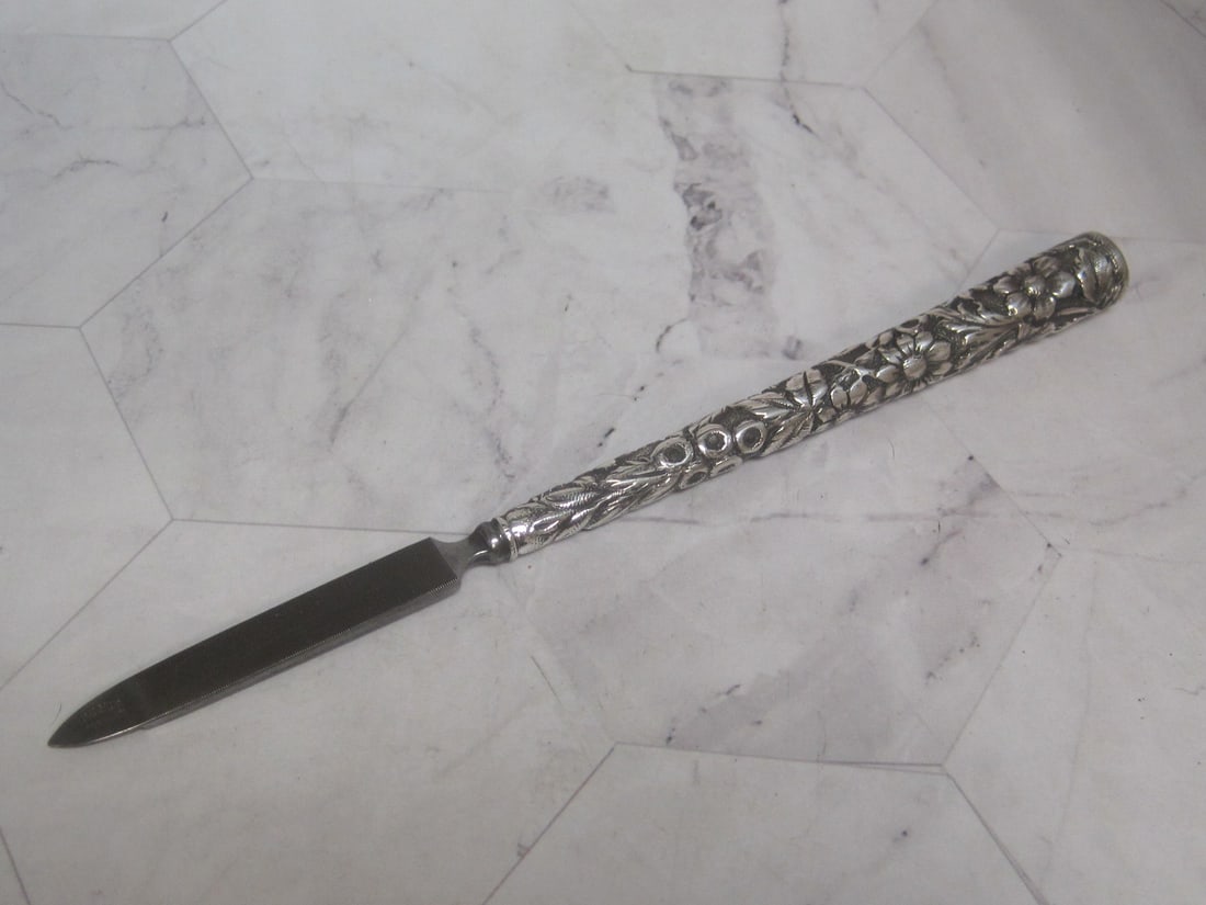 Antique Sterling Silver Handled Repousse Dresser Item: 7 1/4", Nail file, floral, heavy long handle, circa 1890