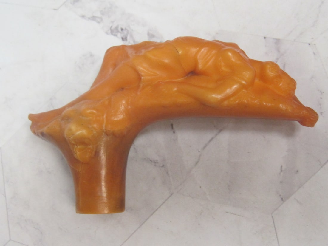Scarce Art Nouveau Amber Handle of Female Laying on Tiger Skin Rug: 4 1/2" long, 1920's, dryness cracking